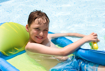 a boy in a swimming pool