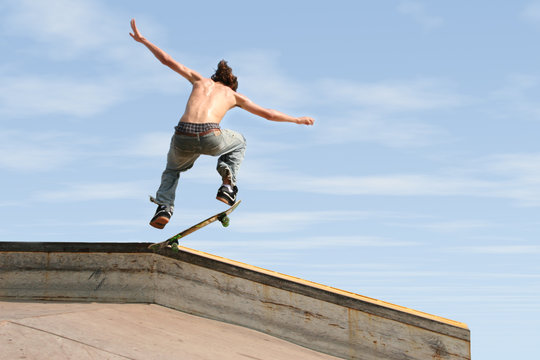 teen boy skateboarding outdoors 3