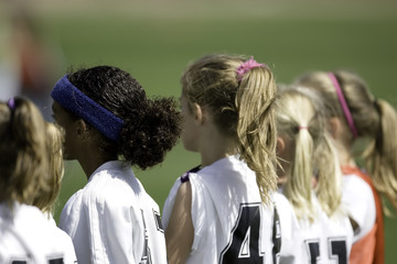 girl soccer players on sideline