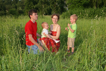 family of four on meadow