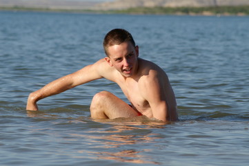 Fototapeta na wymiar teenage boy in lake