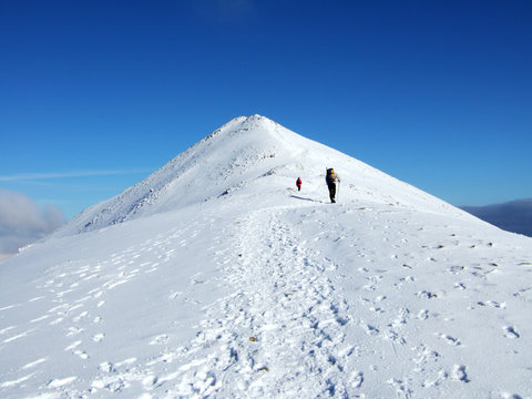 two climbers near the summit of catstyecam
