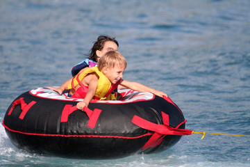 Obraz premium kids on a buoy