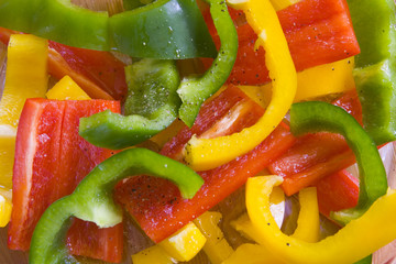 yellow, red and green sliced peppers.