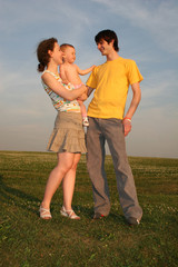 family with baby on evening meadow 2