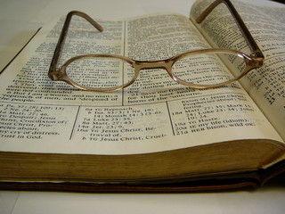 bible with eye glasses