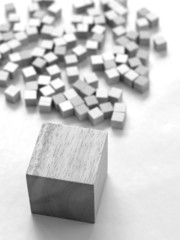 large wooden block before outlines of smaller blocks
