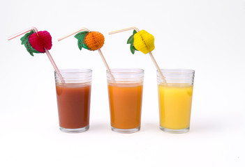 orange, tomato and kiwi juices - in glasses with s