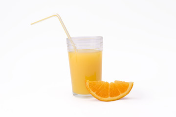 slice of orange and glass of orange juice with str