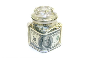 jar with $100 bank notes
