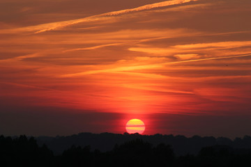 clouds across the setting sun
