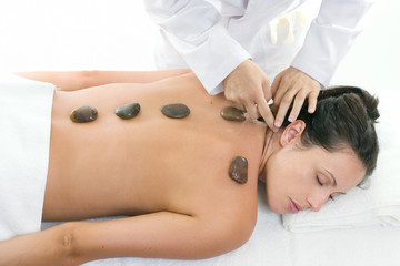Obraz na płótnie Canvas female receiving a relaxing massage treatment