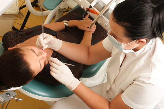 Femal Patient At The Dentist