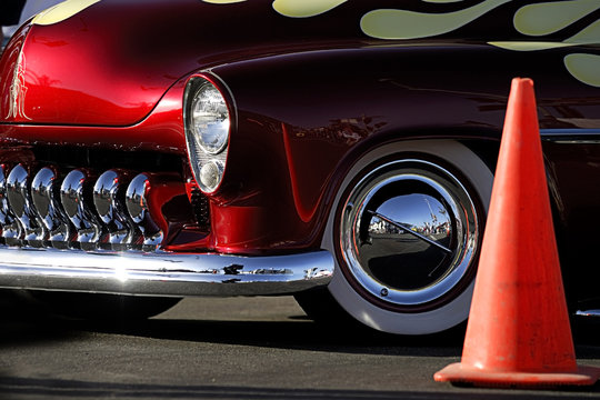 classic car: red, flames & chrome with traffic cone