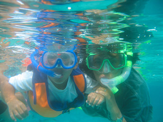 mom and son snorkeling