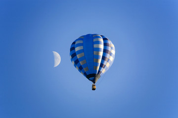 balloon and moon on the blue sky