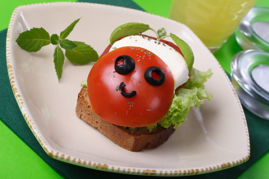 funny sandwich with tomato and mozzarella.