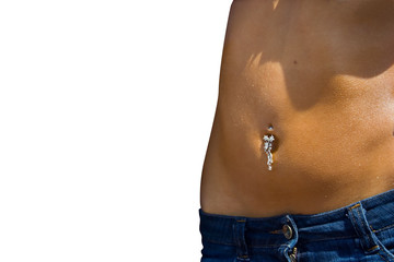 pierced navel of a young woman in bluejeans skirt.