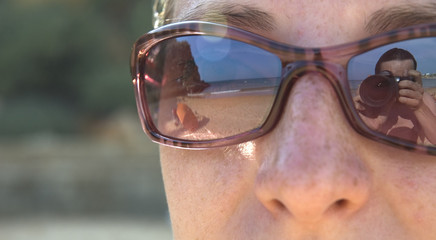 face of the woman in sunglasses