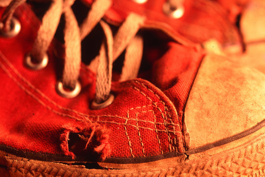 Worn Red Tennis Shoe