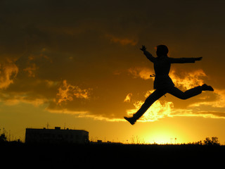 Obraz na płótnie Canvas jump girl sunset