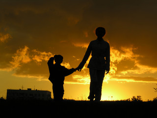 Fototapeta na wymiar mother with son sunset