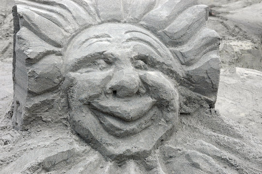 sand sculpture of a sun god