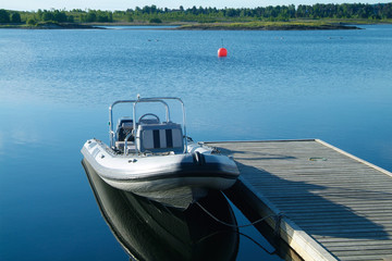 rigid inflatable boat at a pier