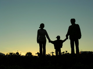 Fototapeta na wymiar family with boy sundown 2