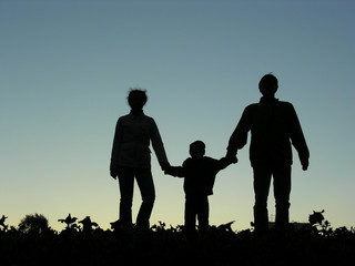 family with boy sundown - obrazy, fototapety, plakaty
