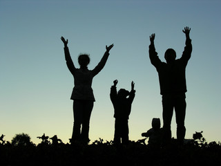 Fototapeta na wymiar family hands up sundown