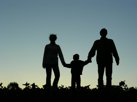 family with boy sundown