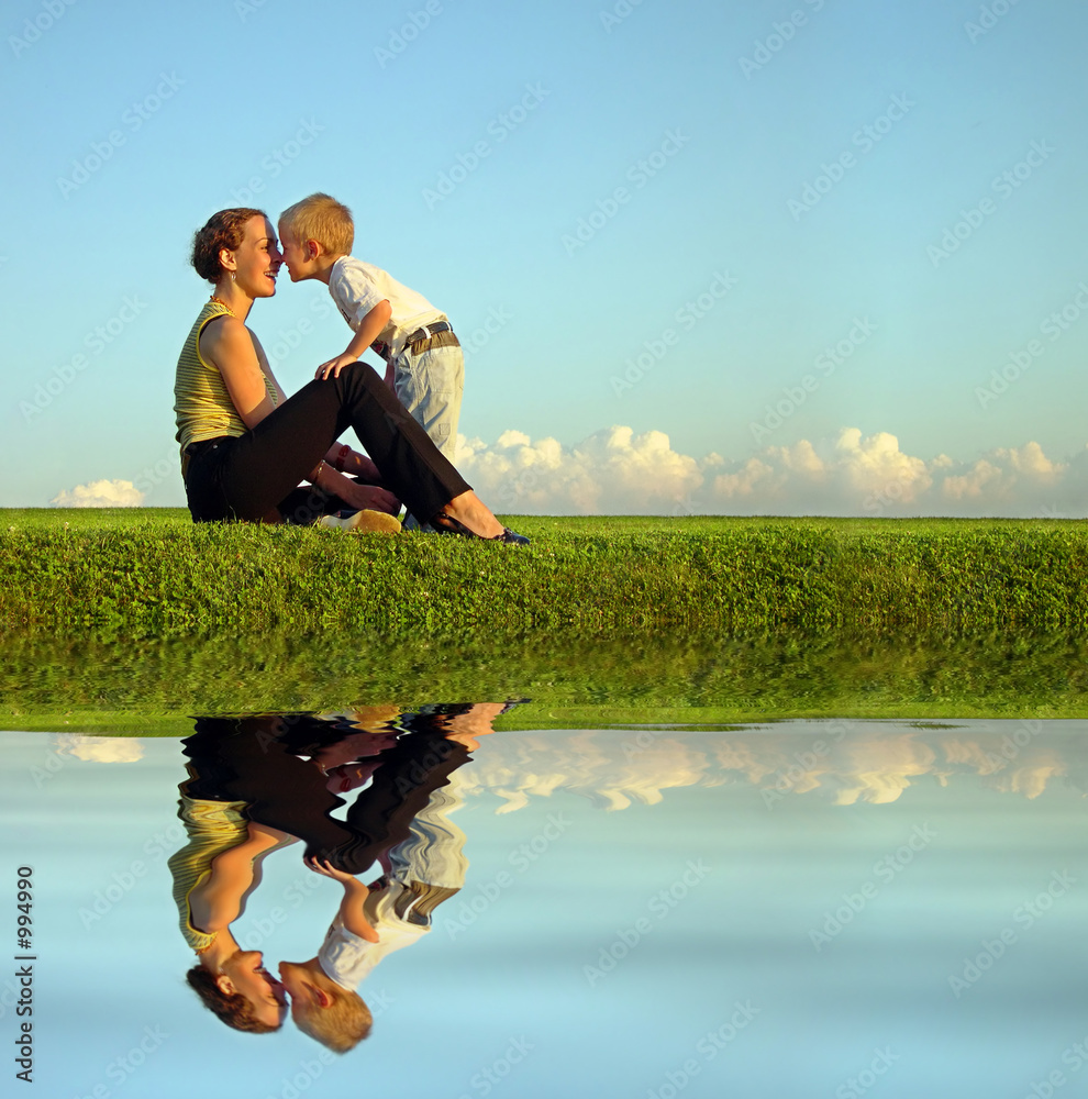 Wall mural mother with son on sundown kiss by nose. long. wat