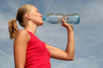 young woman drinking water