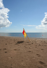 lifeguard on duty flag on beach
