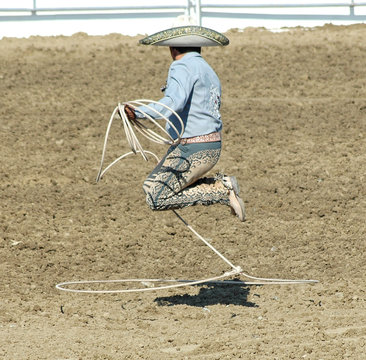 mexican cowboy doing rope trick