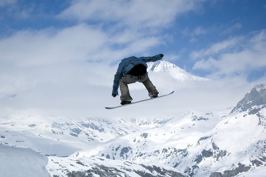 snowboarder jumping high in the air