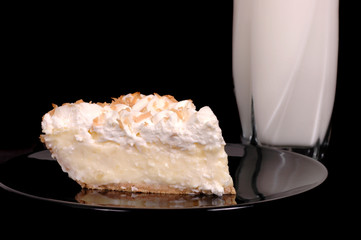 pineapple coconut cream pie with toasted coconut and milk