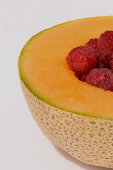 melon with raspberries
