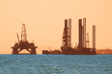 oil rig during sunset in caspian sea