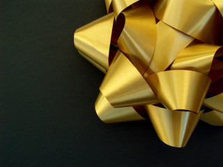 gold bow on black