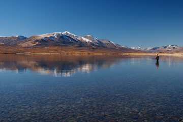 Naklejka premium fishing on a mountain lake