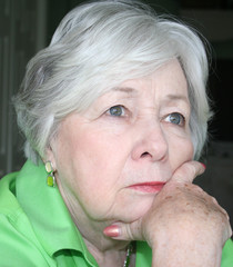 pensive older woman in color