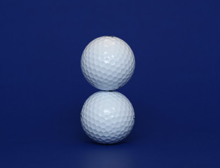 two golf ball standing