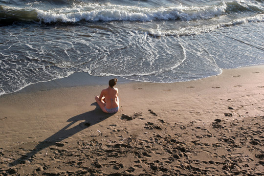 girl sitting at beach