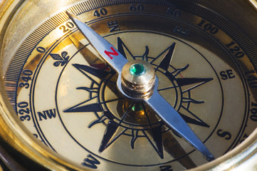 old style gold compass closeup