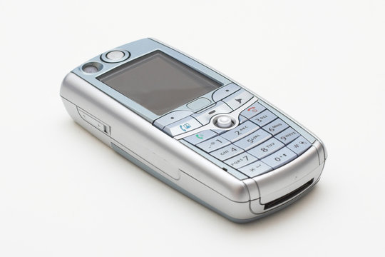 modern old style mobile phone on white background
