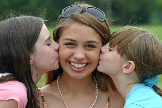 girl smiling getting kissed
