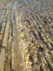 stone pavement half covered under water