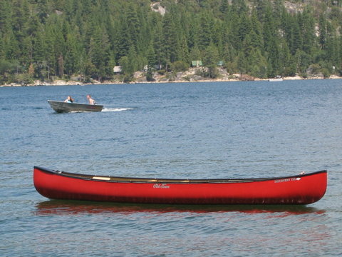 red cannoe on lake